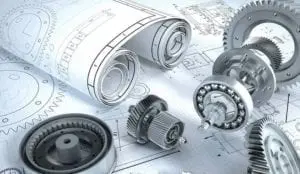 A close up of some mechanical parts on top of a paper