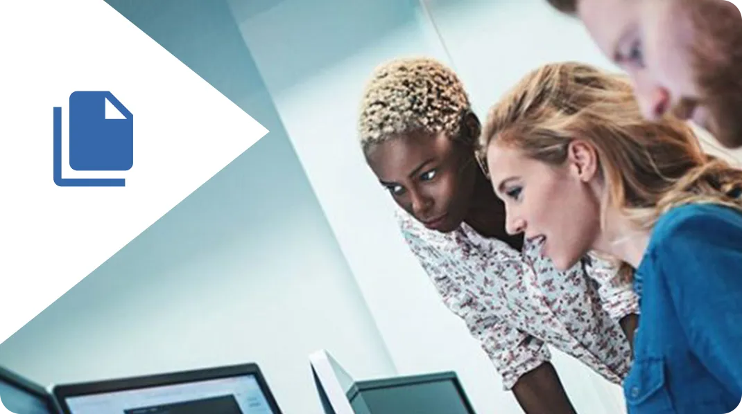 Two women looking at a computer screen.